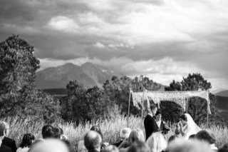 Ceremony: bride, groom, ceremony, crowd, field, mountain