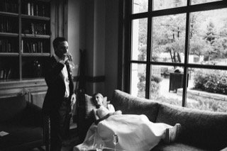 The Couple: bookshelf, bottle, bride, groom, couch, living room