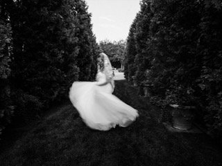 The Couple: wedding dress, bride, dress, flower girl, hedge, tree