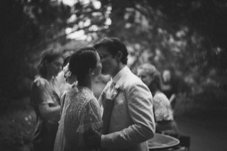 The Couple: bride, groom, cocktail dress, couple, dress, kiss