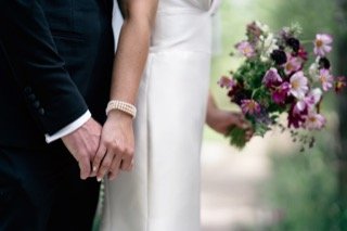 The Couple: bracelet, bouquet, wedding dress, bride, groom, catch