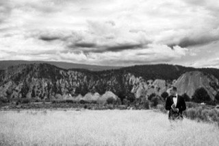 The Couple: cocktail dress, field, grass, grassy, mountain, stand