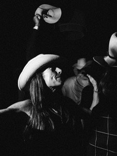 Dancing: club, cowboy hat, crowded, fedora, hat, stand