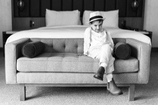 Family and Loved Ones: child, couch, dress, fedora, hat, jumpsuit