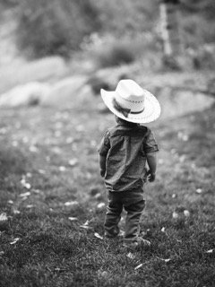 Family and Loved Ones: child, cowboy hat, field, grass, grassy, hat