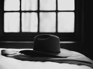 Getting Ready: bed, brim, cloth, comfort, cowboy hat, fedora