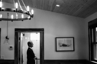 Getting Ready: business suit, ceiling, chandelier, doorway, elevator, picture frame