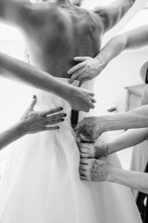 Getting Ready: adjust, wedding dress, bride, bridesmaid, dress, hand