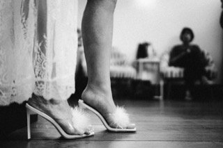 Getting Ready: bride, dress, floor, foot, fur, heel