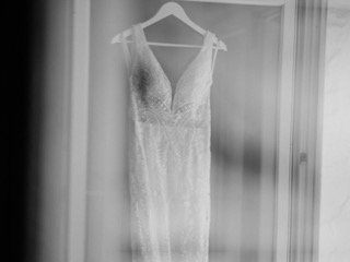 Getting Ready: wedding dress, doorway, dress, garment, hang, hanger